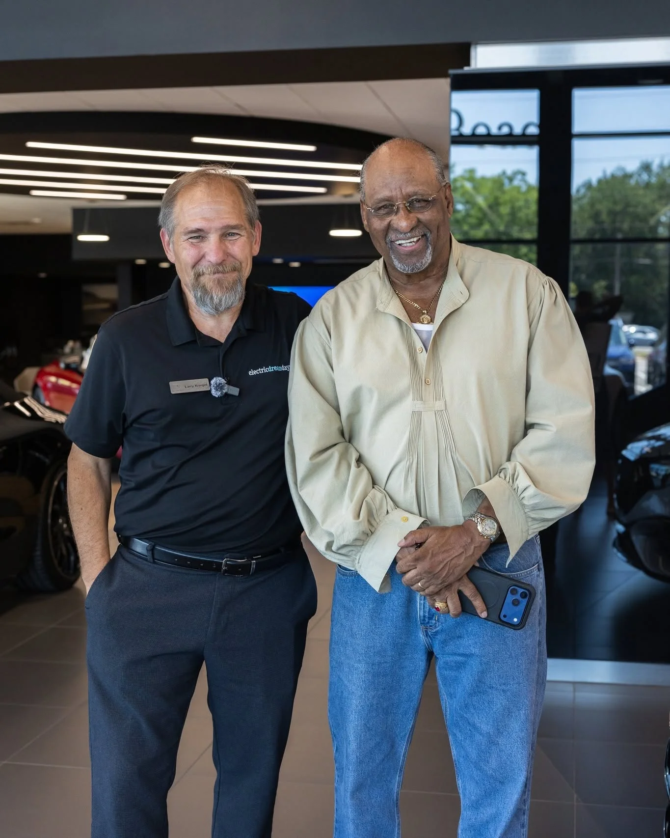 A Mercedes-Benz of Fort Walton Beach client advisor with a returning customer inside the showroom at 1000 Beal Parkway NW