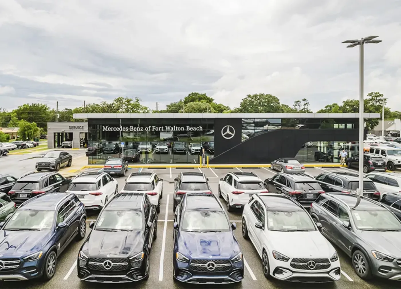Mercedes-Benz of Fort Walton Beach dealership at 1000 Beal Parkway NW, the storefront and lot of GLE SUVs in Fort Walton Beach, Florida
