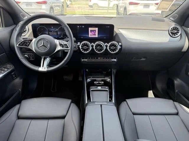 Interior of a certified pre-owned Mercedes-Benz showing the dashboard, screens, and seats