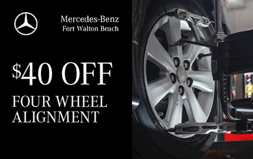 Four-wheel alignment, $40 off, with an alignment clamp mounted on a silver Mercedes-Benz wheel