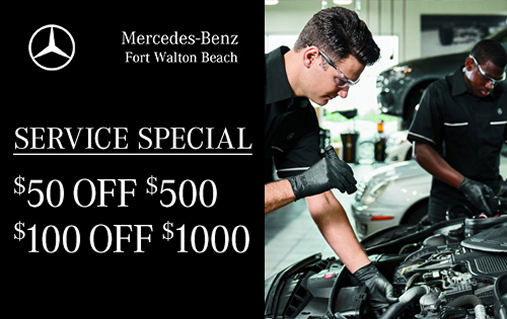 Service Special, $50 off $500 and $100 off $1000, with two Mercedes-Benz technicians working under an open hood