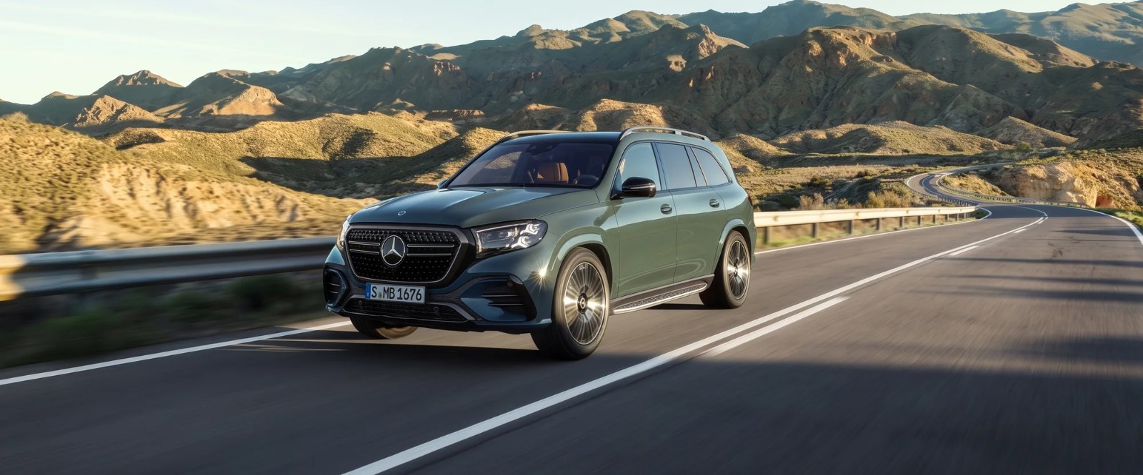 A Mercedes-Benz GLS SUV on a mountain highway